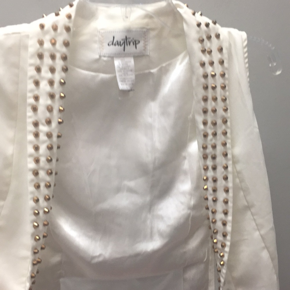 Day trip cream colored vest with gold stud details